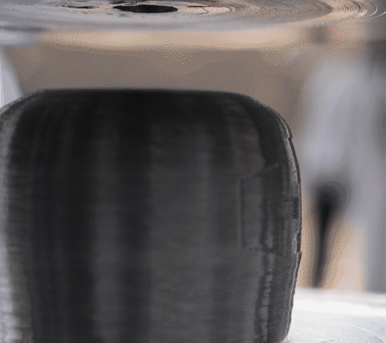 Animated press test of MK2 bump stop bulging outward along a single waist crease under full compression.